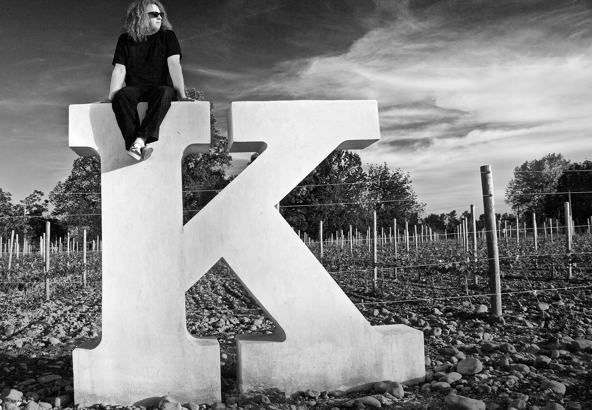 Winemaker Charles Smith sits atop a giant K