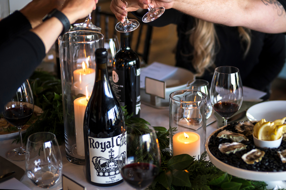 people toasting with wine on table